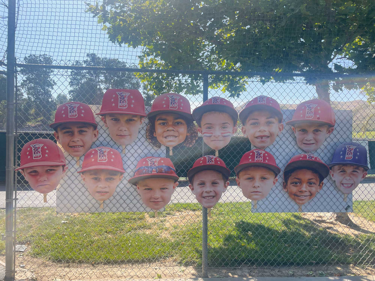 Big head cutouts of a baseball team